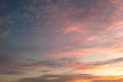 Low angle view of dramatic sky during sunset