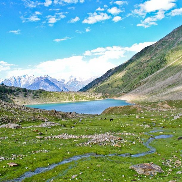 mountain, mountain range, tranquil scene, tranquility, scenics, water, beauty in nature, lake, sky, nature, landscape, cloud - sky, grass, idyllic, non-urban scene, cloud, river, countryside, day, blue