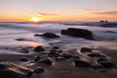 View of calm sea at sunset