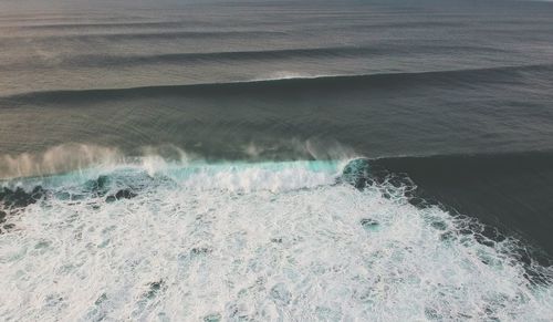 Sea waves splashing on shore