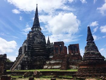 Old temple buildings against sky