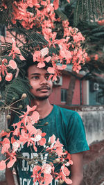 Midsection of woman holding flowers