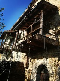 Low angle view of abandoned building against clear sky