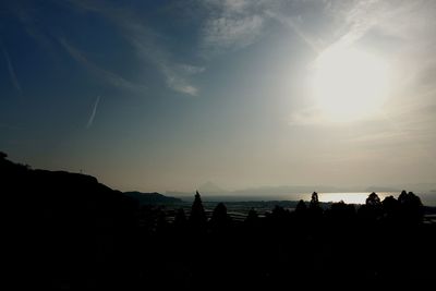 Silhouette of people at sunset
