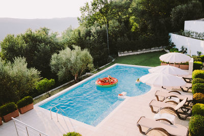 High angle view of swimming pool against trees