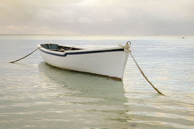 Boat in sea against sky