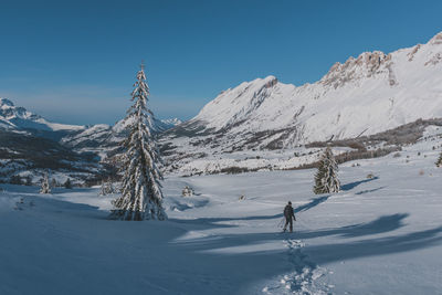 Scenic view of snowcapped mountains against sky
