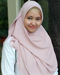 Portrait of smiling mid adult woman wearing hijab