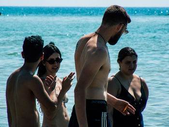 Group of people at sea shore