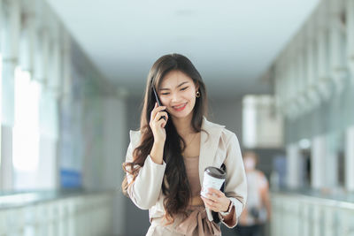 Young woman using mobile phone