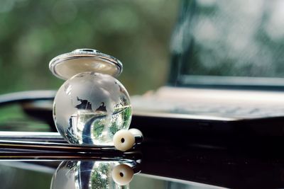 Close-up of glass window on table