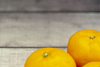 Close-up of oranges on table