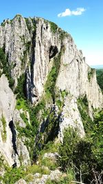 Low angle view of rock formations against sky