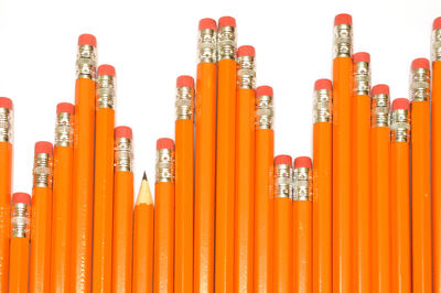 Close-up of multi colored pencils against white background