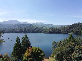 Scenic view of lake and mountains against sky