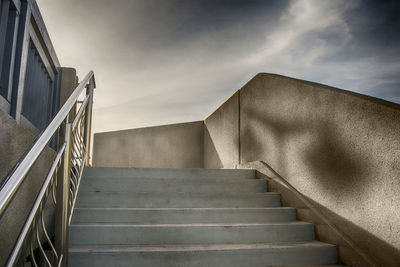 Concrete staircase to the sky with dramatic clouds
