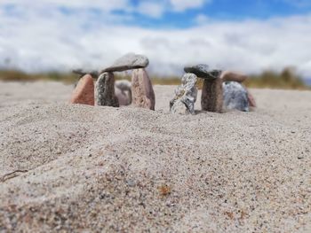 Close-up of miniature stonehenge on a beach