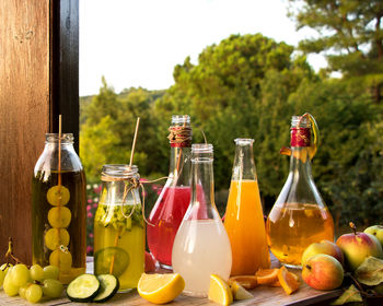 Various fruits in jar on table