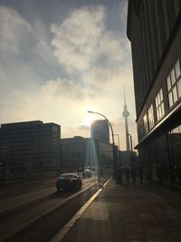 City street against cloudy sky