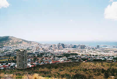High angle view of buildings in city against sky