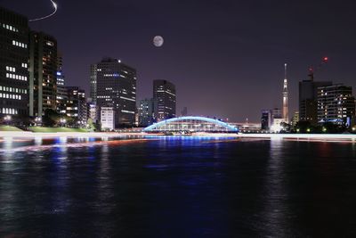 Illuminated city at waterfront