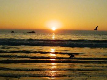 Scenic view of sea at sunset