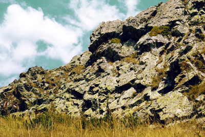 Rock formation on land against sky