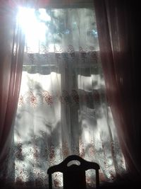 Man seen through window