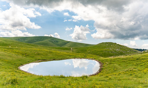 Lessinia mountains and a water pond
italian alps