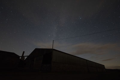 Low angle view of building against sky at night