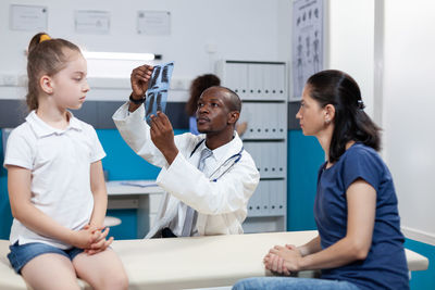 Doctor examining patient at clinic