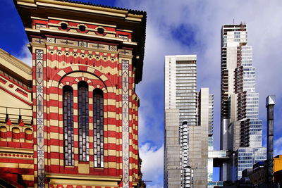 Low angle view of buildings in city against sky