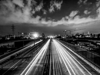 High angle view of light trails on highway at night