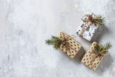 Christmas flat lay with christmas present on a grey stone background.