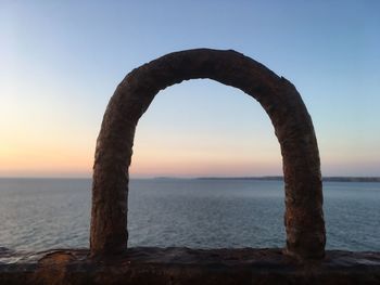 Scenic view of sea against clear sky during sunset