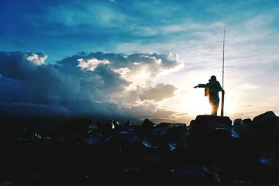 Silhouette of people at sunset