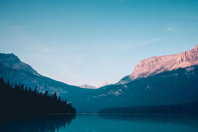 Scenic view of snowcapped mountain against blue sky