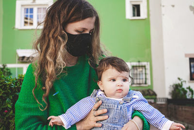 Portrait of mother and daughter outdoors