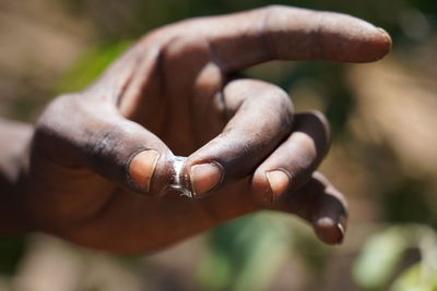 Close-up of man holding hands