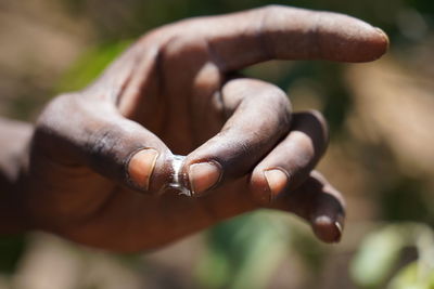 Close-up of hand holding gum