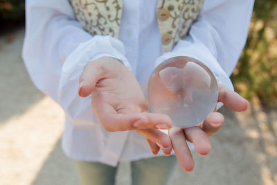 Midsection of woman holding ice cream