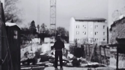 Woman standing in front of building