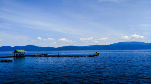 Scenic view of sea against blue sky