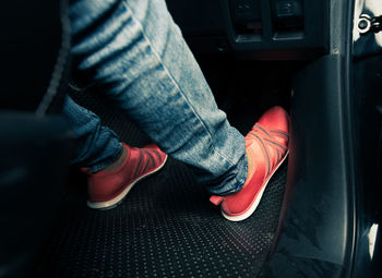 Low section of man sitting in car