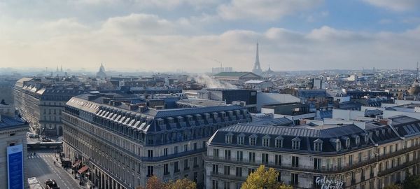 High angle view of buildings in city against sky