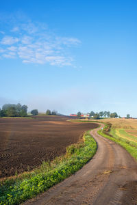 Winding dirt road in a rural landscape