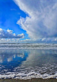 Scenic view of sea against blue sky