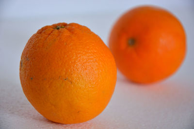 Close-up of orange fruit on table