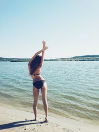 Woman standing on beach