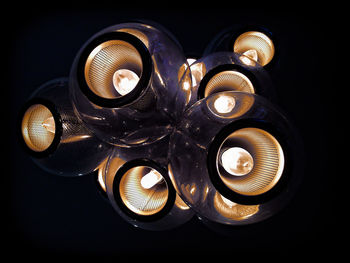 Close-up of light bulb against black background